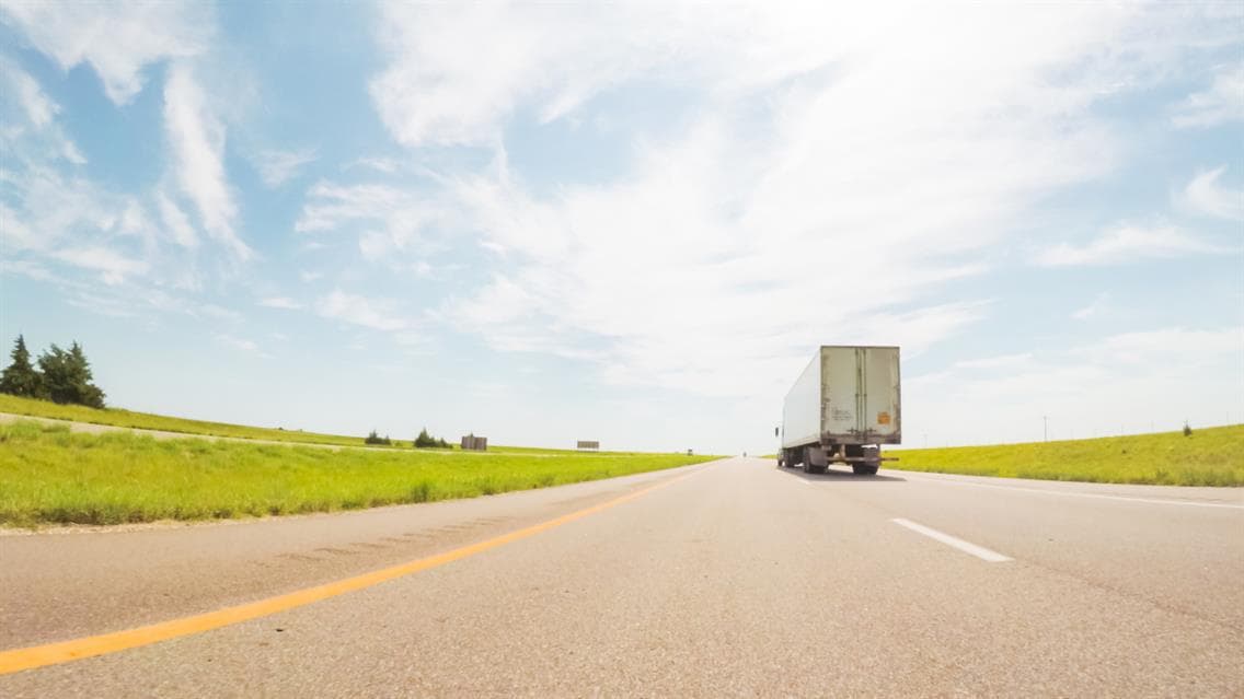 Transport truck driving on the road