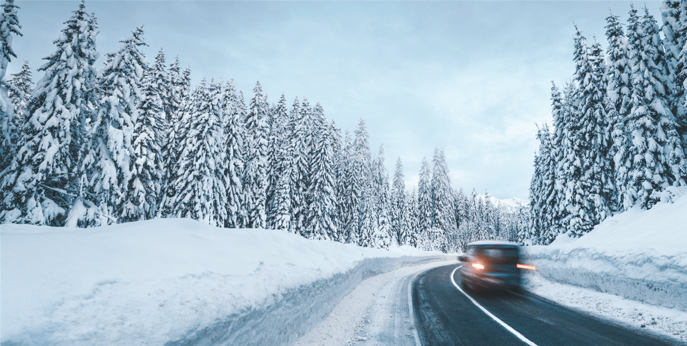 Car going through a snow covered road