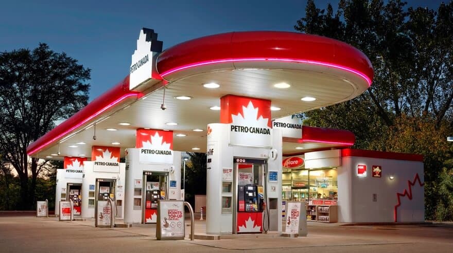 A Petro-Canada gas station at night, with the canopy lit up